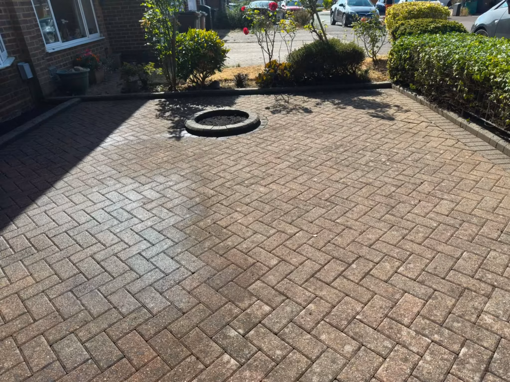 Block paving driveway part way through jet washing in Luton